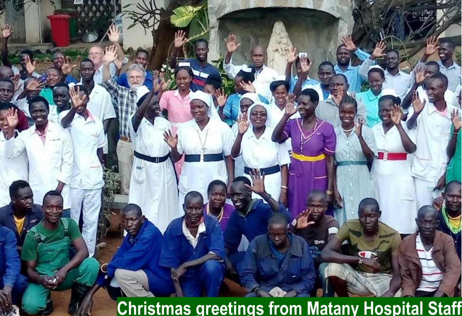 the staff of St Kizito Hospital in Matany stand outside the hospital