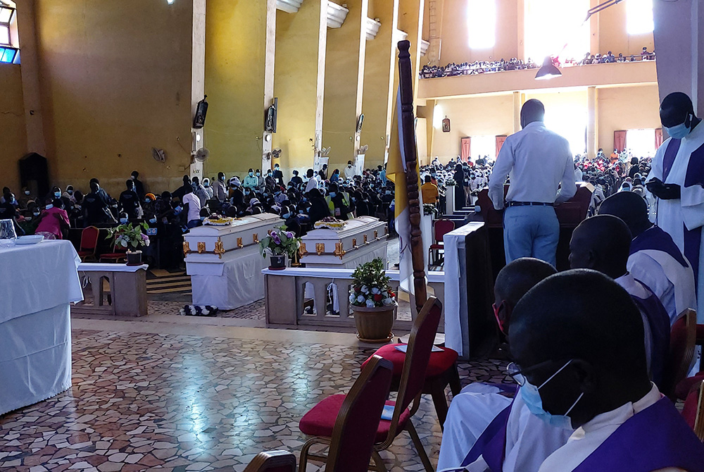 Members of the Archdiocese of Juba, South Sudan, attend the Aug. 20 funeral Mass of Srs. Mary Daniel Abut and Regina Roba, Sisters of the Sacred Heart who were killed when their bus was attacked August 16.
