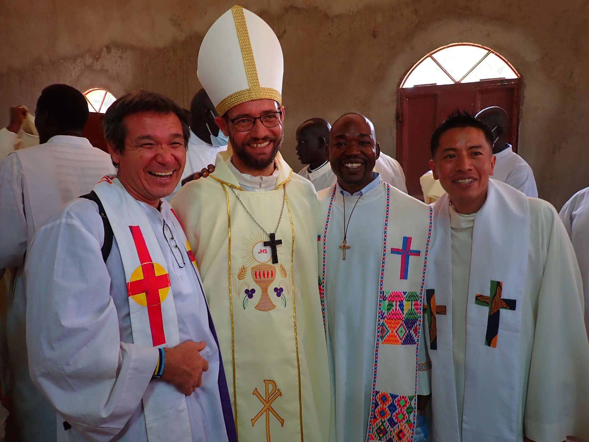 Fr Gregor, Bishop Christian and another priest stand together in their priestly outfits