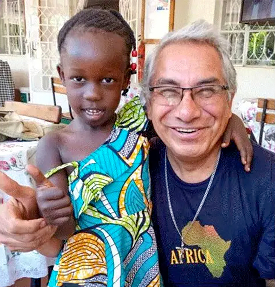Fr Jesus Nava with a South Sudanese child