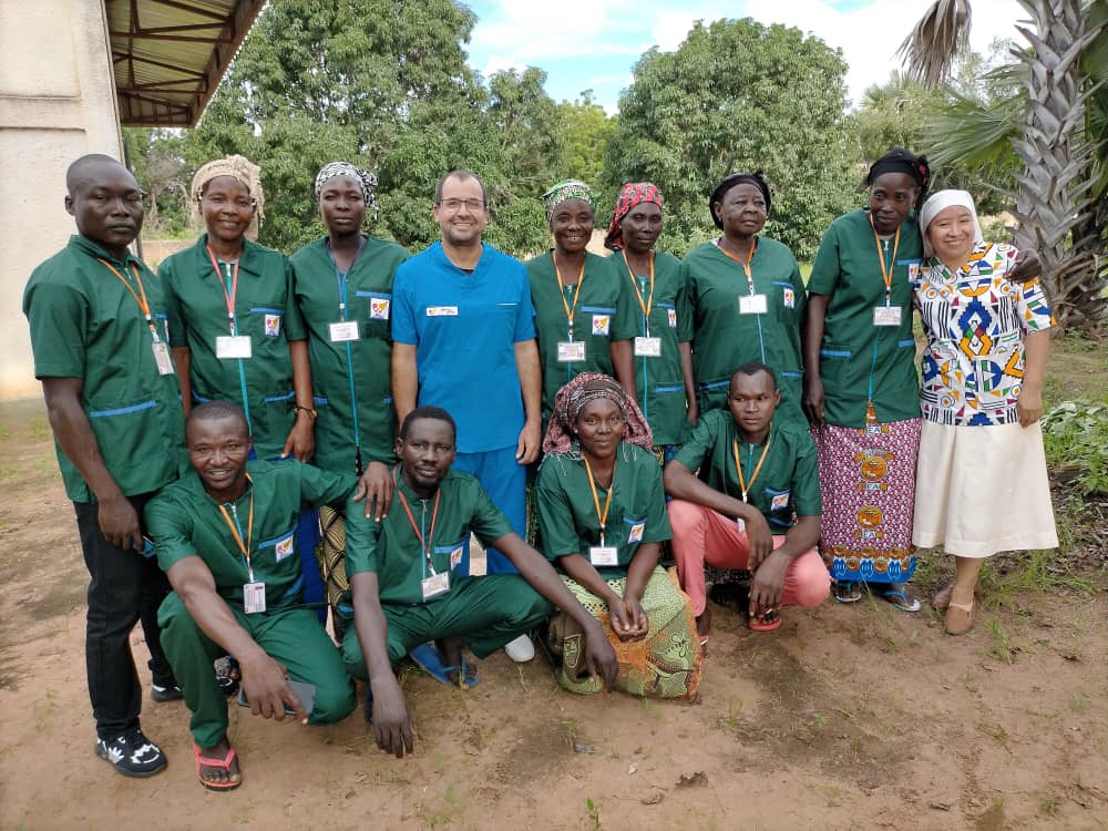 Comboni Brother Dr. Salgado poses with some of his team from St. Michael Hospital.